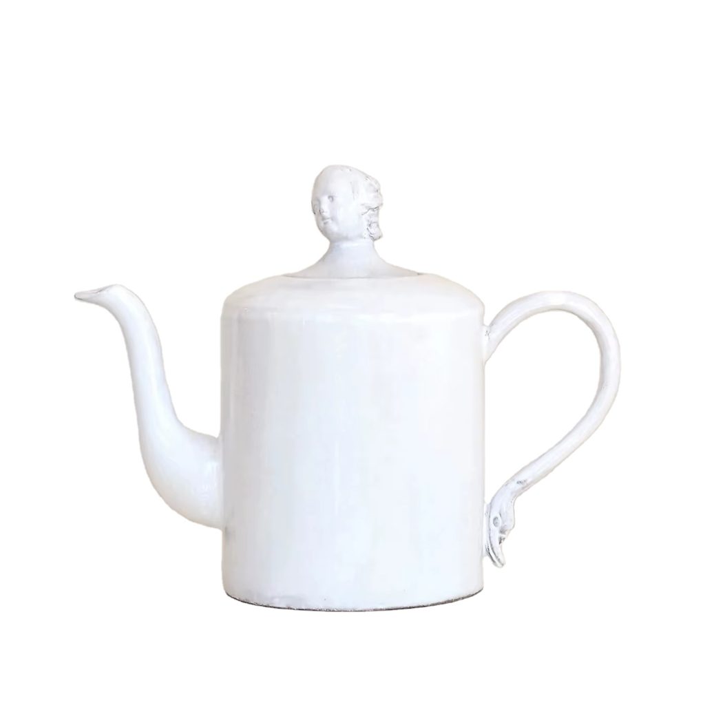 A handcrafted ceramic teapot with milky white glaze
