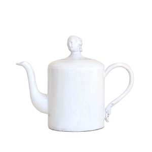 A handcrafted ceramic teapot with milky white glaze